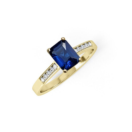 Y/G Emerald Cut Blue CZ Ladies Ring